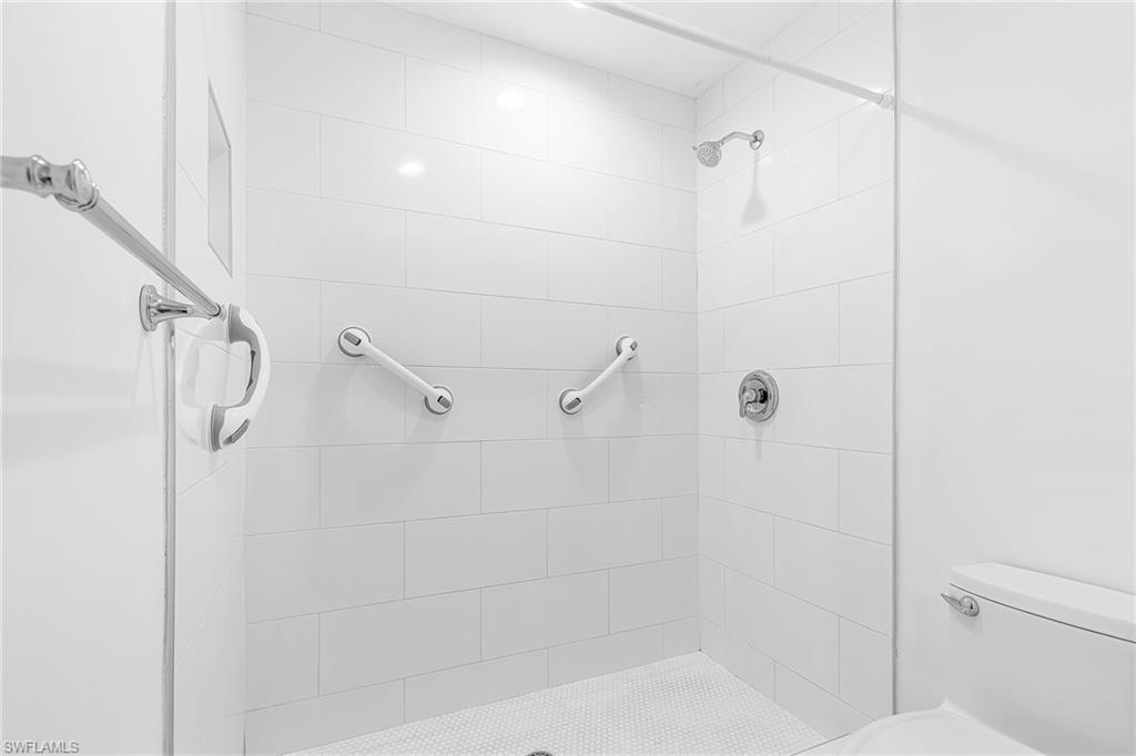 661 Windsor Square, Unit 101 Naples, FL 34104 - Photo 20 of 40 a bathroom with a shower