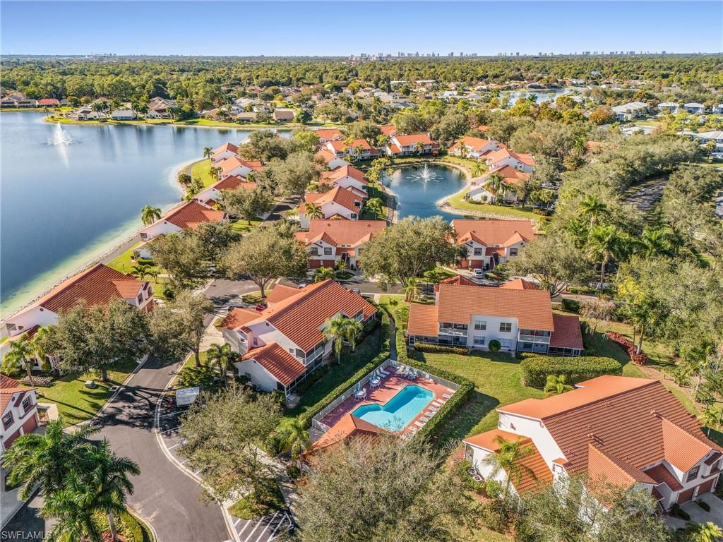 661 Windsor Square, Unit 101 Naples, FL 34104 - Photo 35 of 40 an aerial view of residential houses with outdoor space and river
