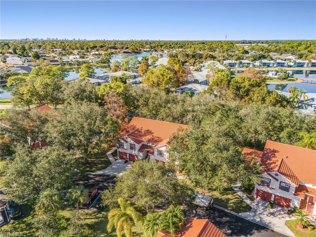 661 Windsor Square, Unit 101 Naples, FL 34104 - Photo 37 of 40 an aerial view of residential building with parking space