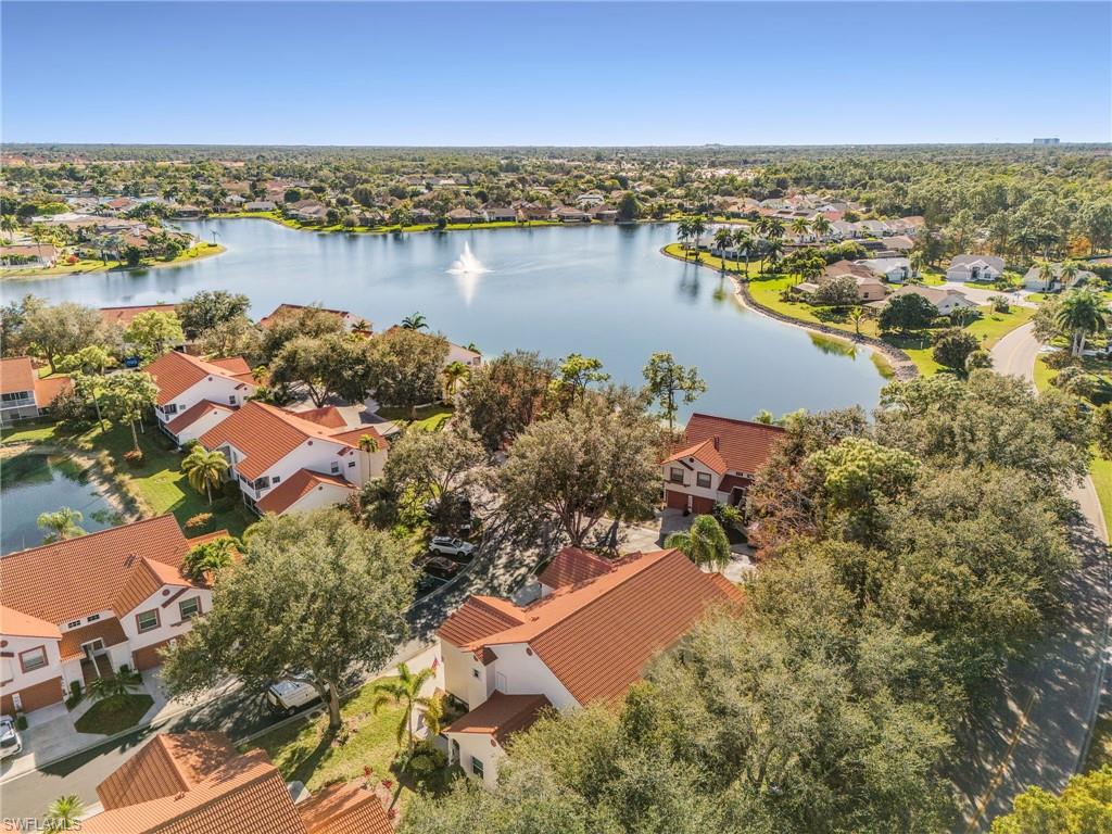 661 Windsor Square, Unit 101 Naples, FL 34104 - Photo 38 of 40 an aerial view of residential building with outdoor space and lake view