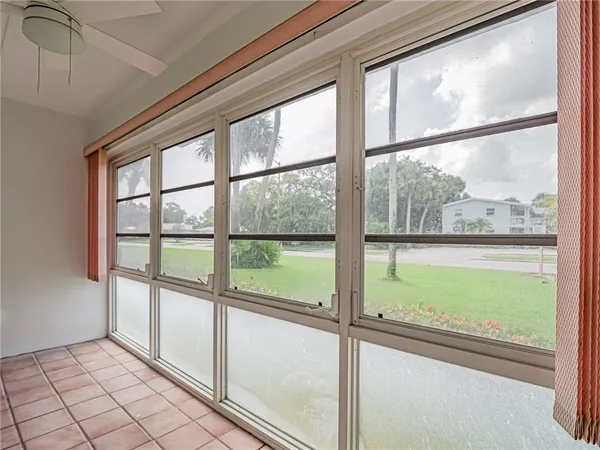 a view of an empty room with a large window
