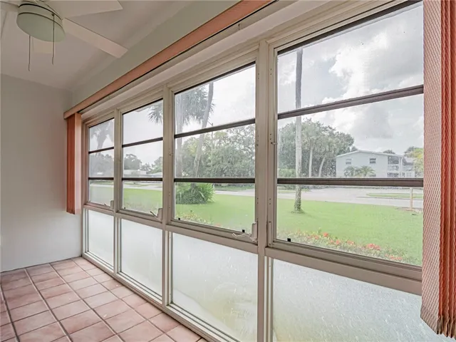 a view of an empty room with a large window