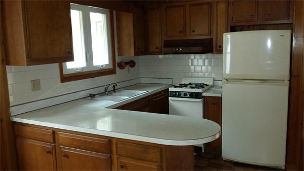 35 Mason Road Freetown, MA 02717 - Photo 5 of 16 a kitchen with a refrigerator and a sink