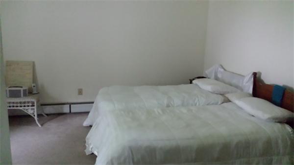 35 Mason Road Freetown, MA 02717 - Photo 8 of 16 a large bed sitting in a bedroom next to a window