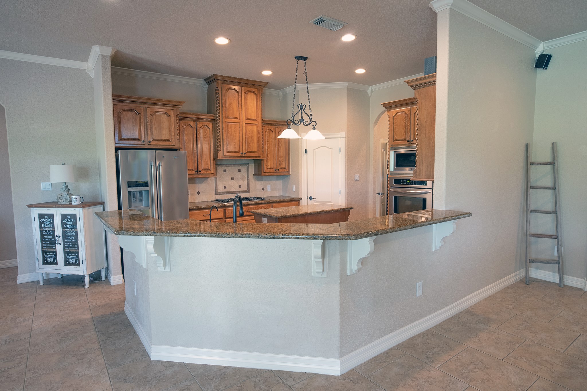 544 Wagon Wheel Trail Angleton, TX 77515 - Photo 13 of 45 A large kitchen flowing effortlessly into the family room-perfect for entertaining