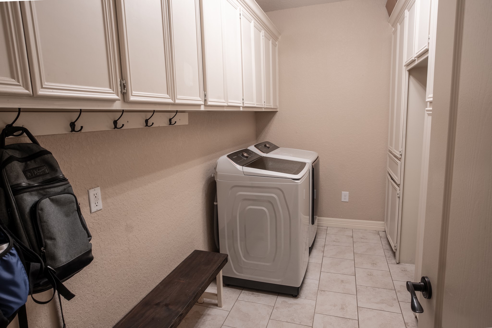 544 Wagon Wheel Trail Angleton, TX 77515 - Photo 24 of 45 Spacious laundry room with built-in storage for backpacks and everyday essentials