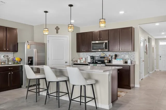 a living room with furniture and windows