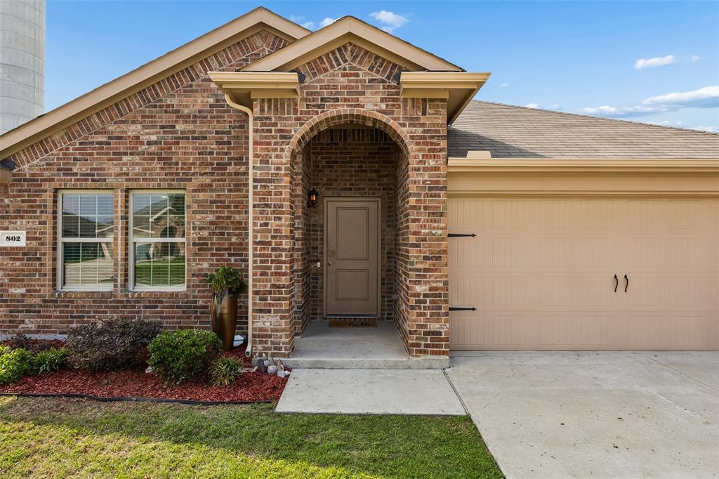 802 Rustic Way Royse City, TX 75189 - Photo 5 of 38 a front view of a house with garden