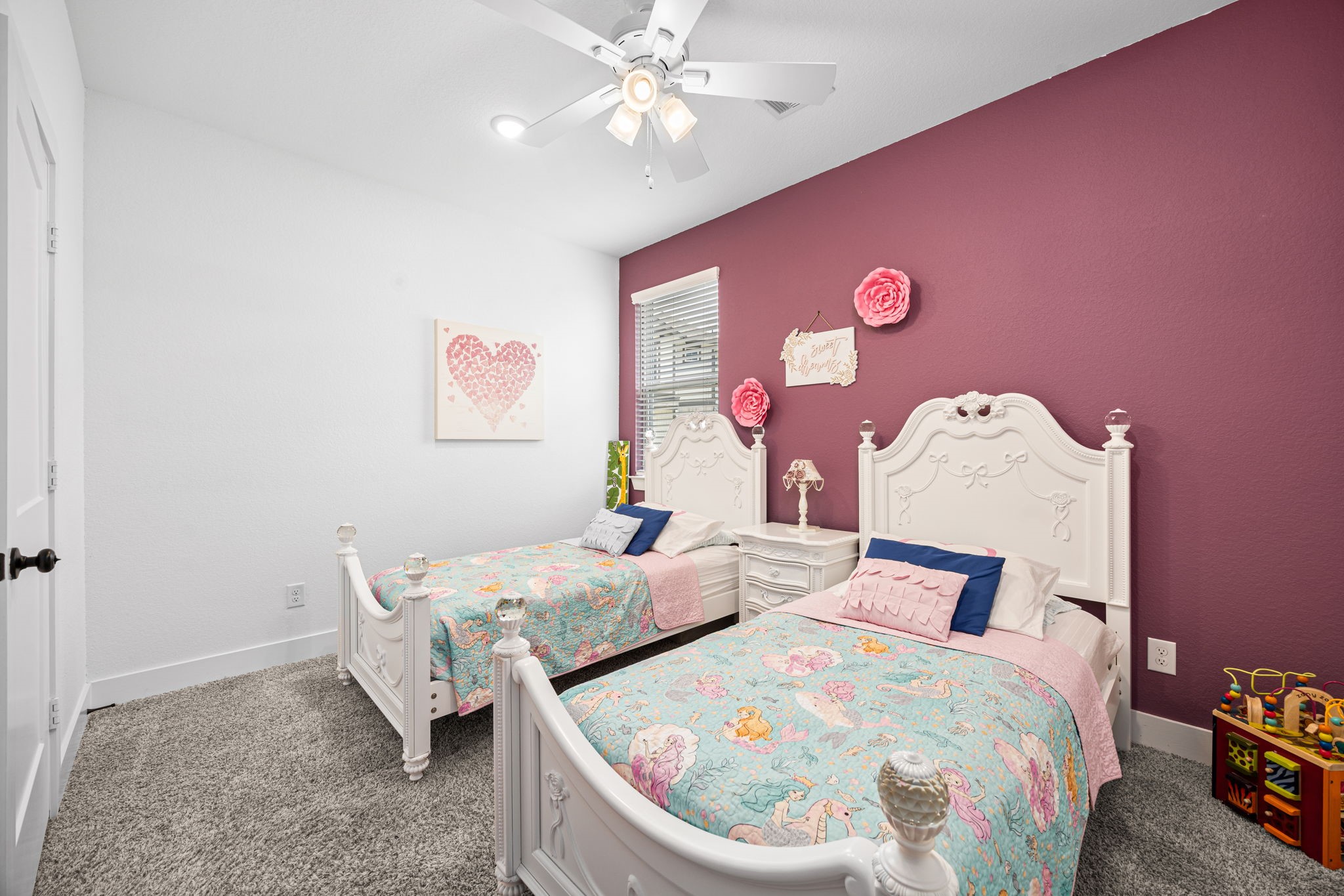 7618 Redbud Orchard Road Katy, TX 77493 - Photo 18 of 26 Bedroom #1 is located at the rear of the home, overlooking the peaceful backyard. This room is proportioned for Full/Queen-sized furnishings and can also acoommodate a shared space with two Twin beds, as shown here. THis room feeatures a spacious closet and ceiling fan for year-round comfort.