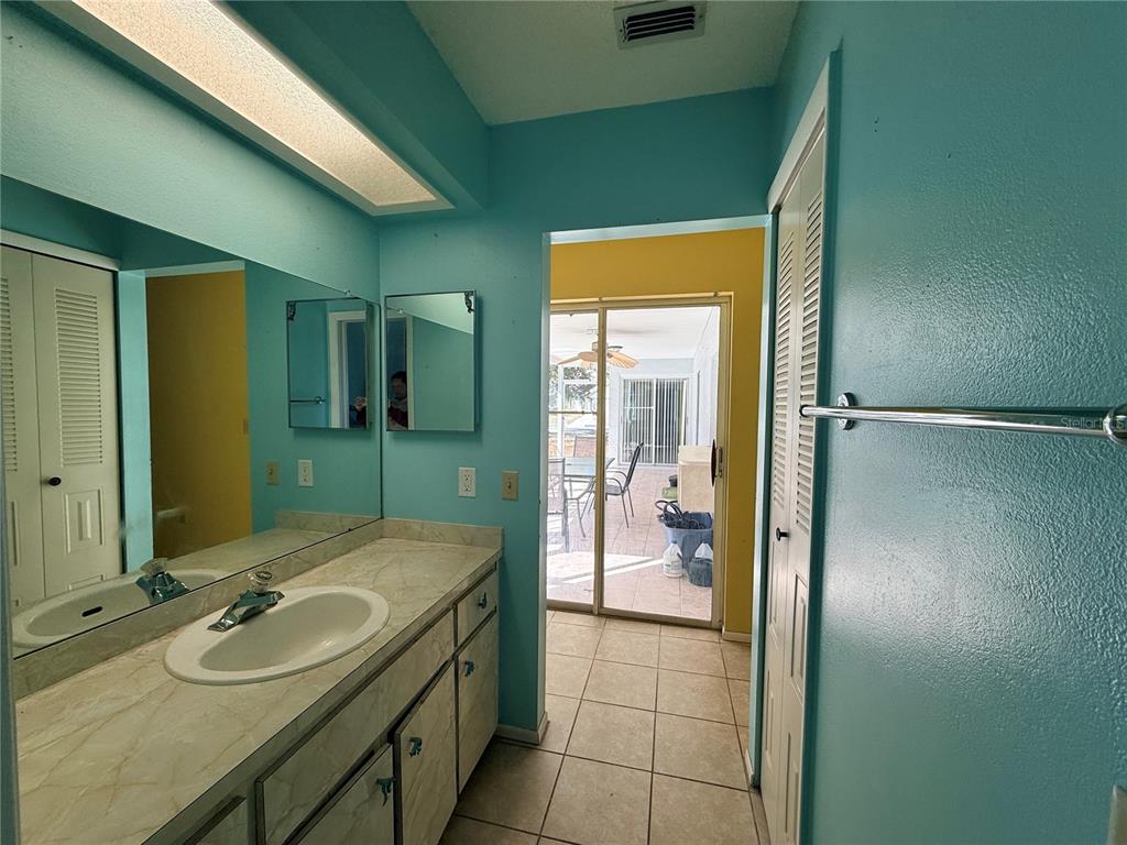 3410 Hartley Road Spring Hill, FL 34606 - Photo 11 of 29 a bathroom with a sink and a mirror
