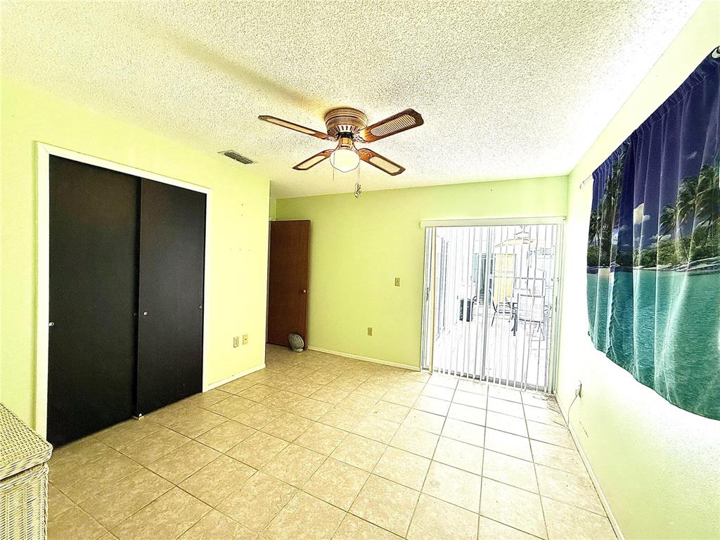 3410 Hartley Road Spring Hill, FL 34606 - Photo 16 of 29 a view of empty room with wooden floor