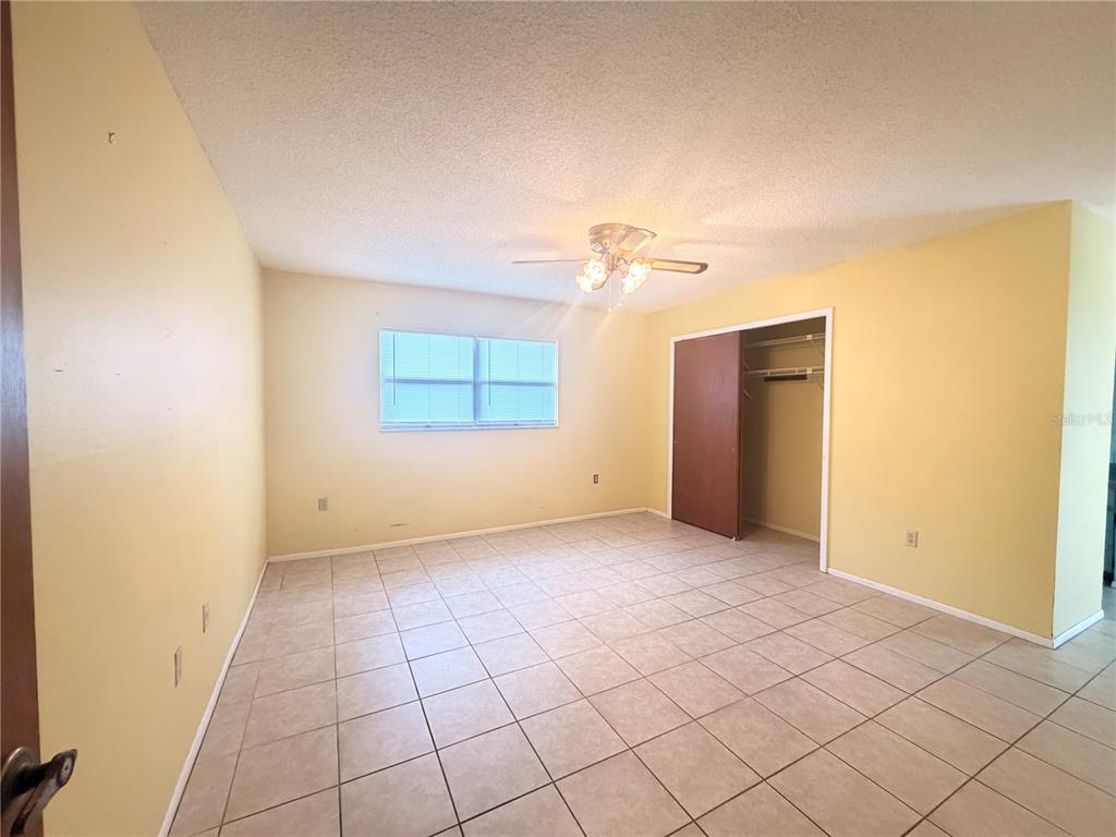 3410 Hartley Road Spring Hill, FL 34606 - Photo 17 of 29 a view of an empty room with a window