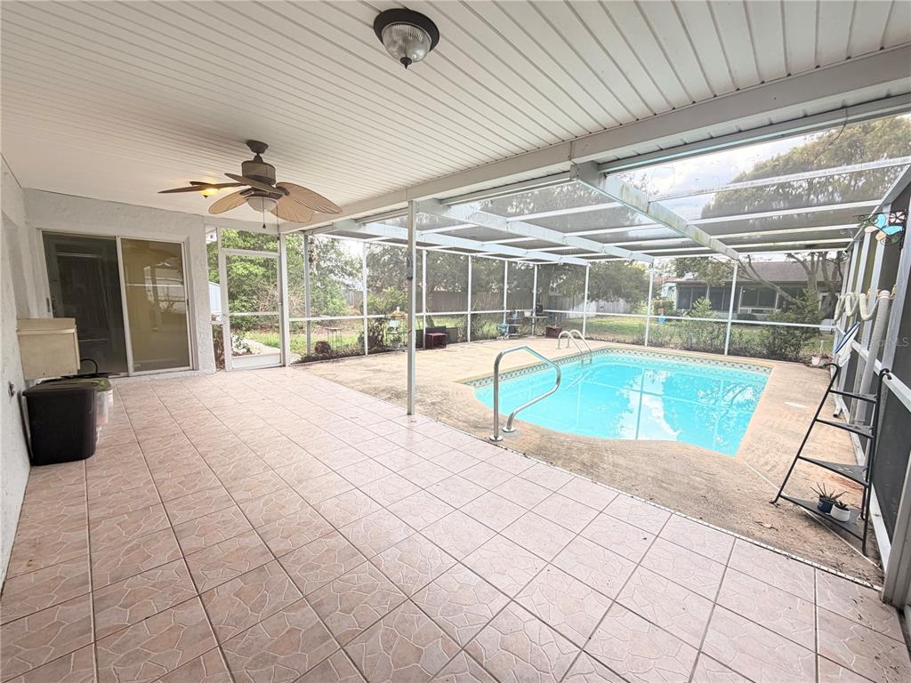 3410 Hartley Road Spring Hill, FL 34606 - Photo 19 of 29 a view of a swimming pool with a patio