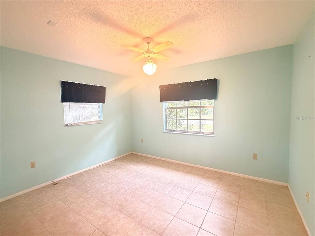3410 Hartley Road Spring Hill, FL 34606 - Photo 21 of 29 a view of an empty room with a window