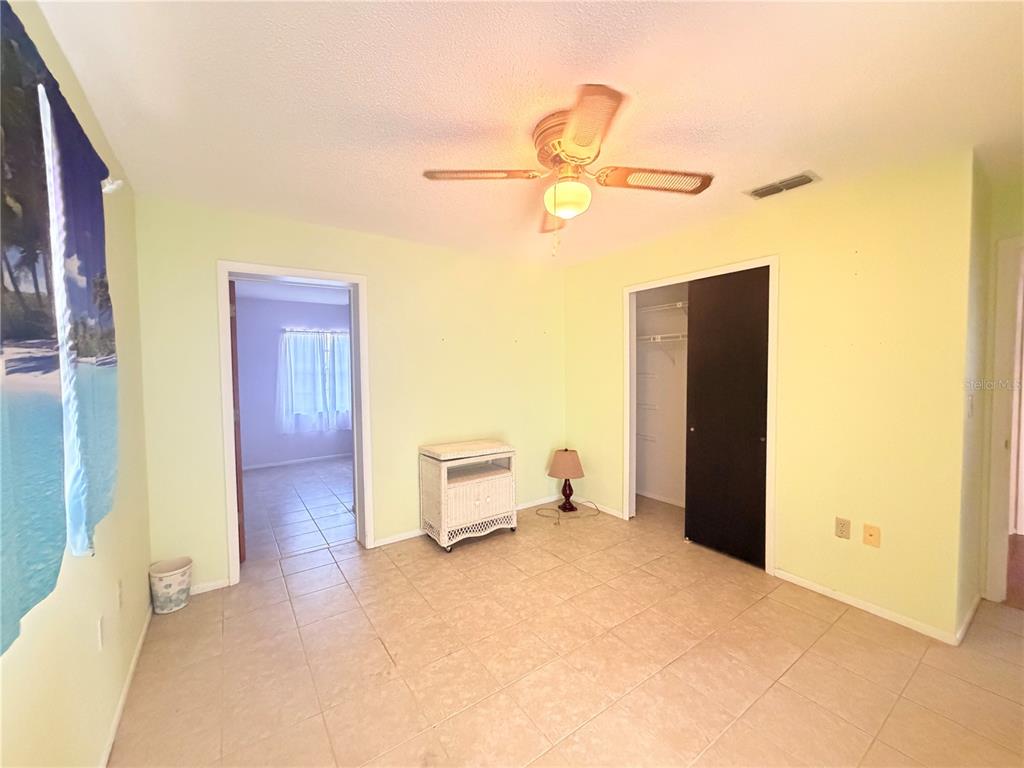 3410 Hartley Road Spring Hill, FL 34606 - Photo 24 of 29 a view of a livingroom with a furniture and a ceiling fan
