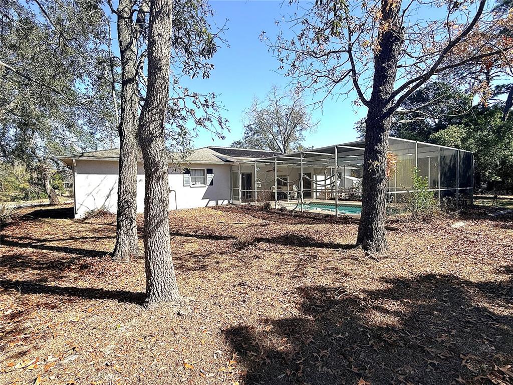 3410 Hartley Road Spring Hill, FL 34606 - Photo 26 of 29 a front view of a house with a yard