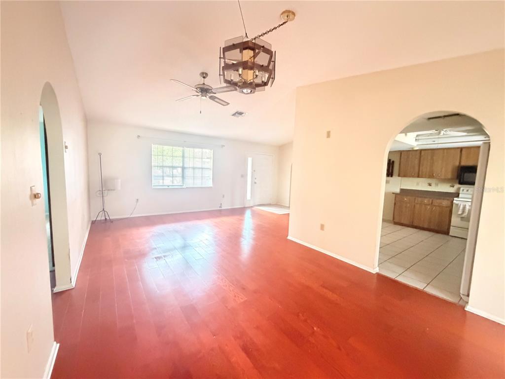 3410 Hartley Road Spring Hill, FL 34606 - Photo 7 of 29 a view of a livingroom with wooden floor