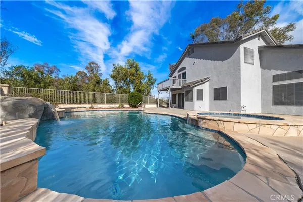 a view of a house with swimming pool