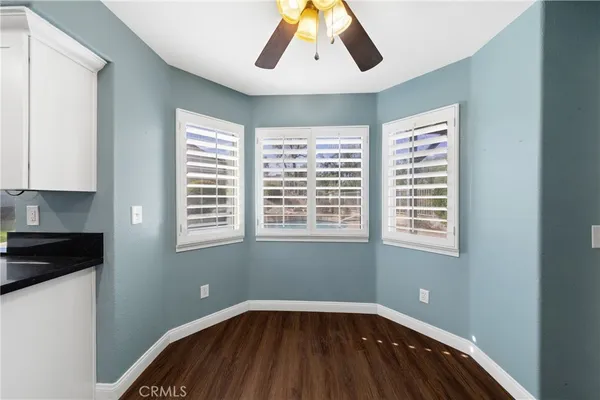 a view of a livingroom with a dishwasher and a window
