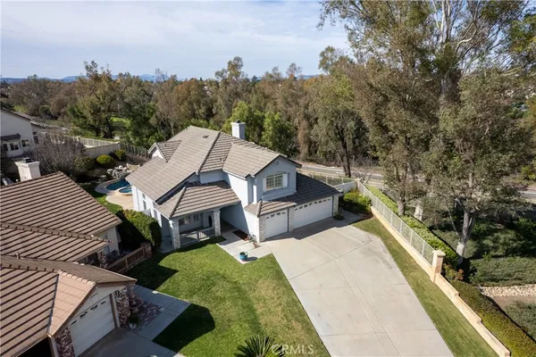 an aerial view of a house with outdoor space