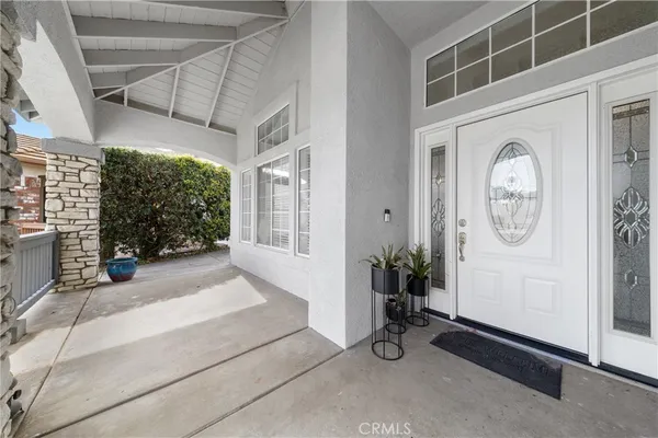 a very nice looking room with a large window and a fireplace