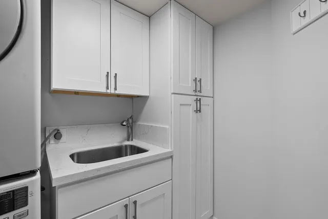 a kitchen with a sink and cabinets