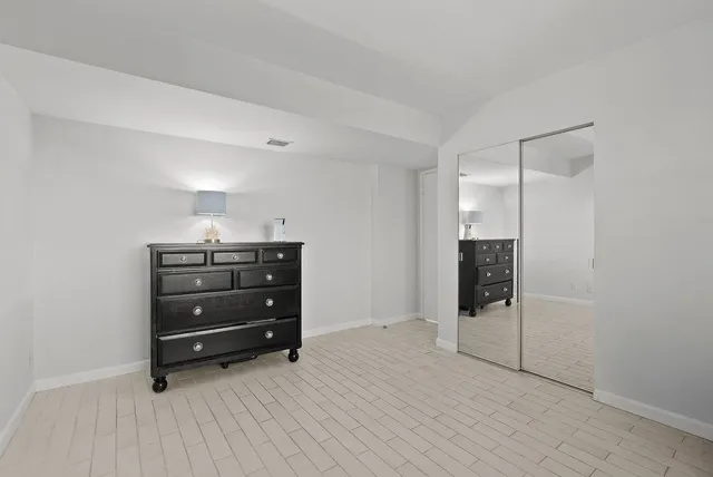 a room with a dresser