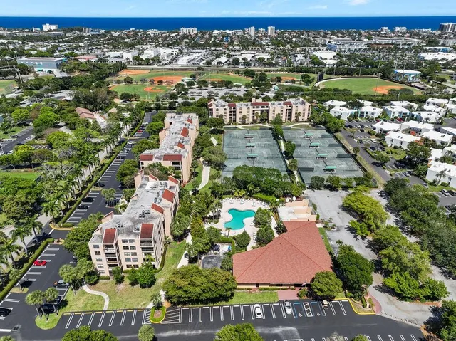 an aerial view of residential houses with outdoor space