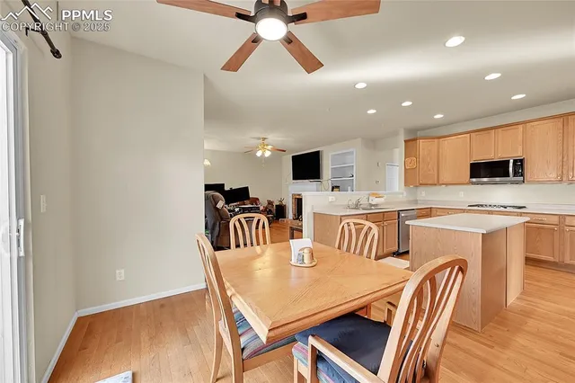 a view of a dining room with furniture and a chandelier