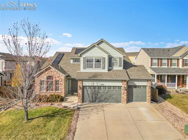a front view of a house with yard and seating area