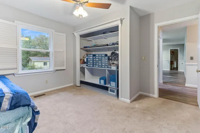 a view of a livingroom with furniture and window