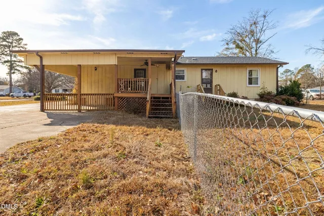 a view of a backyard with a patio