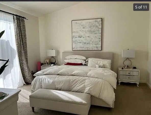 a bedroom with a bed and a couch