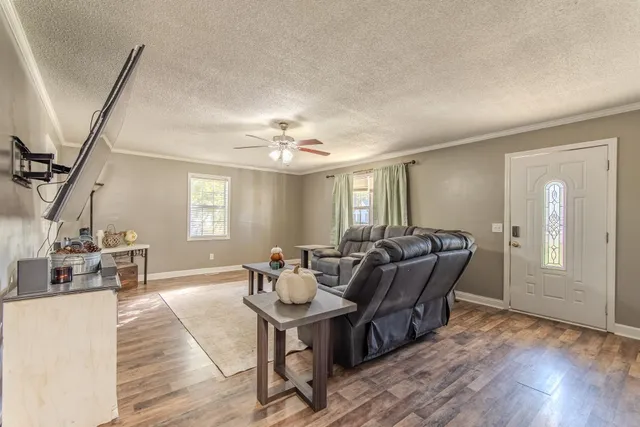 a view of a dining room with furniture and wooden floor