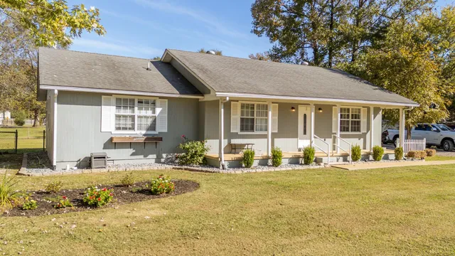 a front view of a house with a patio