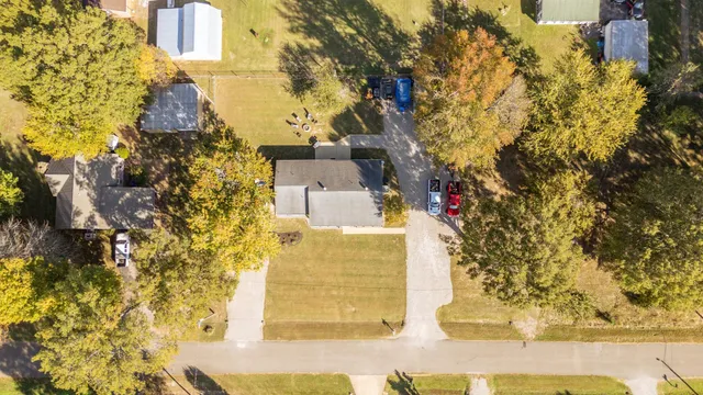 a aerial view of a residential apartment building with a yard