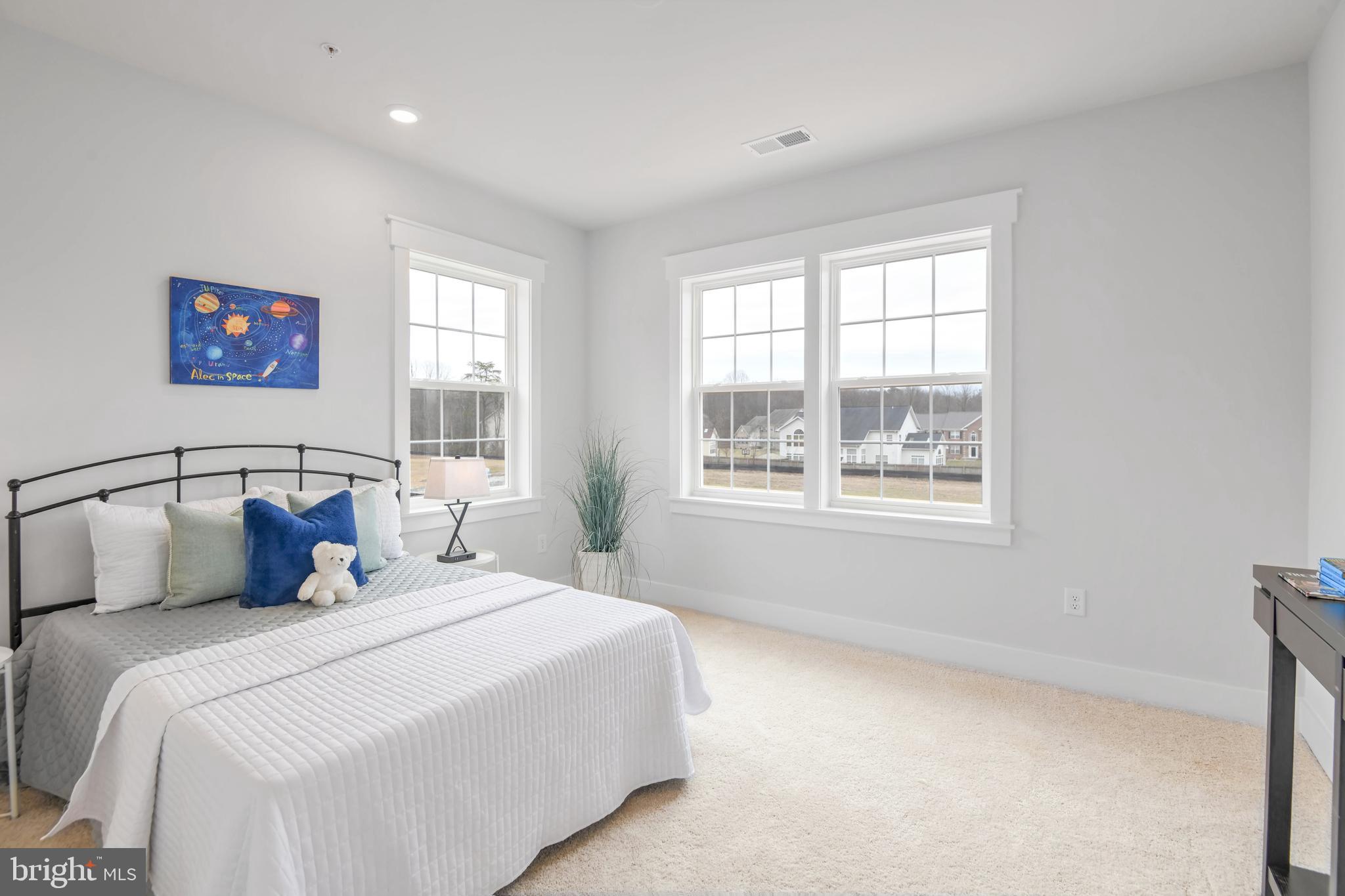 Eliana Court Laurel, MD 20708 - Photo 29 of 46 a bedroom with a large bed and a window