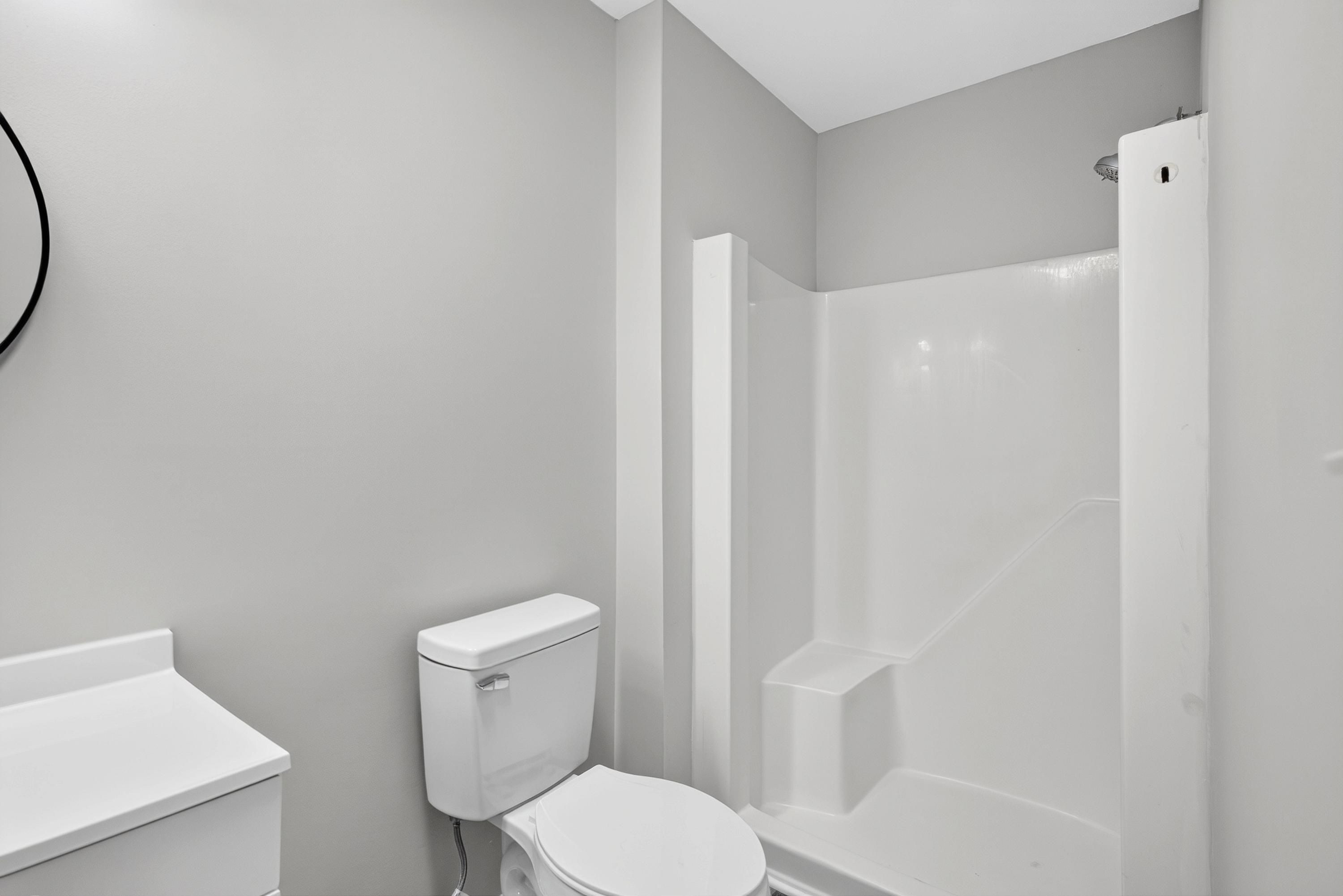 708 Powell Drive, Unit A Raleigh, NC 27606 - Photo 32 of 56 Primary bath with toilet and shower area
