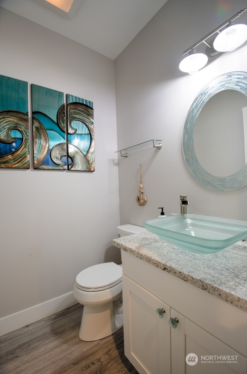 37 Richard Lane Elma, WA 98541 - Photo 14 of 26 a bathroom with a granite countertop toilet sink and mirror