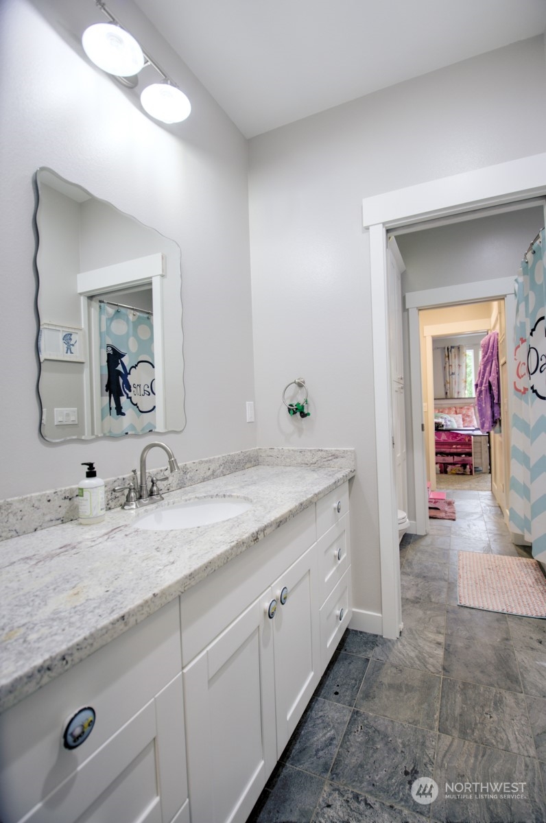37 Richard Lane Elma, WA 98541 - Photo 17 of 26 a en suite bathroom with double sink and a mirror