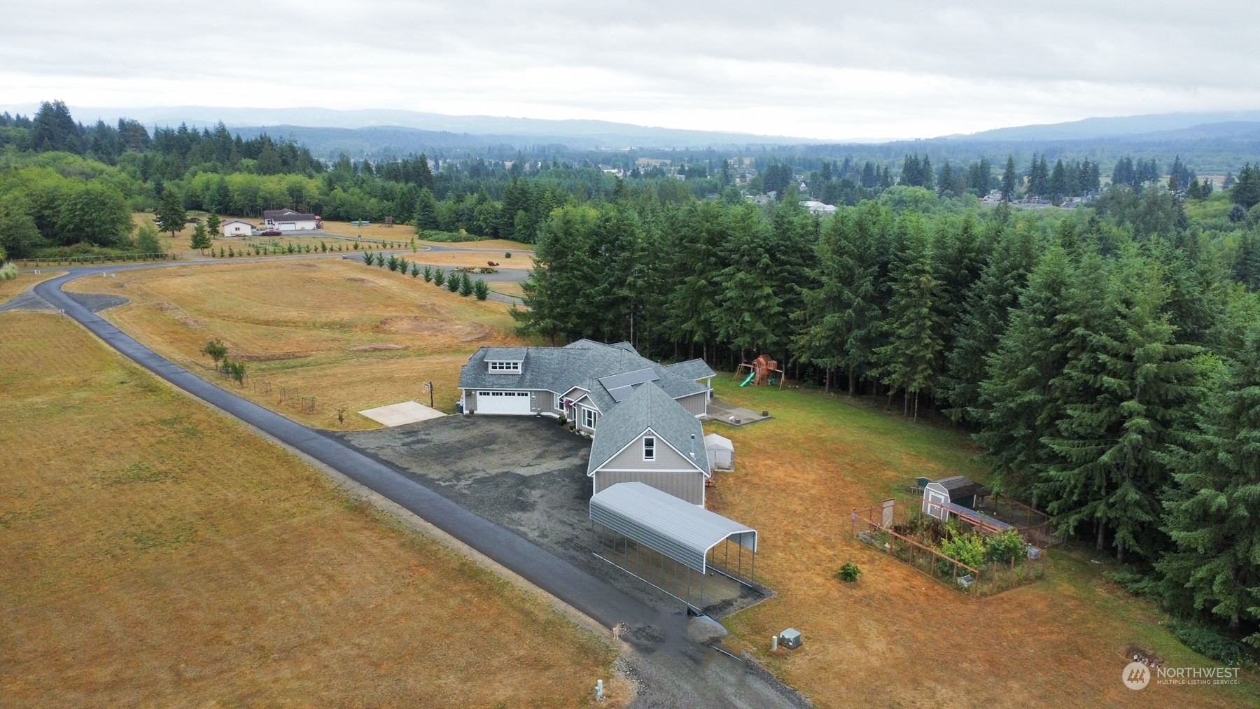 37 Richard Lane Elma, WA 98541 - Photo 2 of 26 a view of a house with a yard and mountain view
