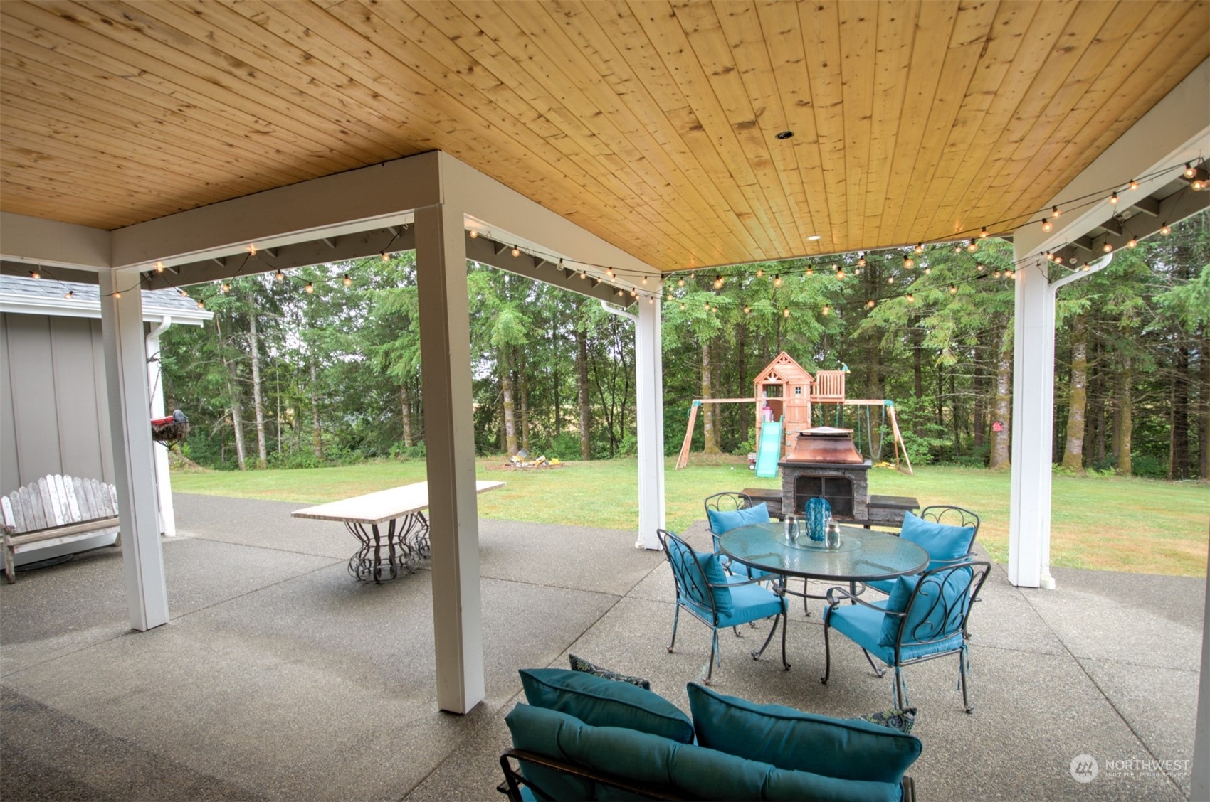 37 Richard Lane Elma, WA 98541 - Photo 22 of 26 a patio with yard glass top table and chairs