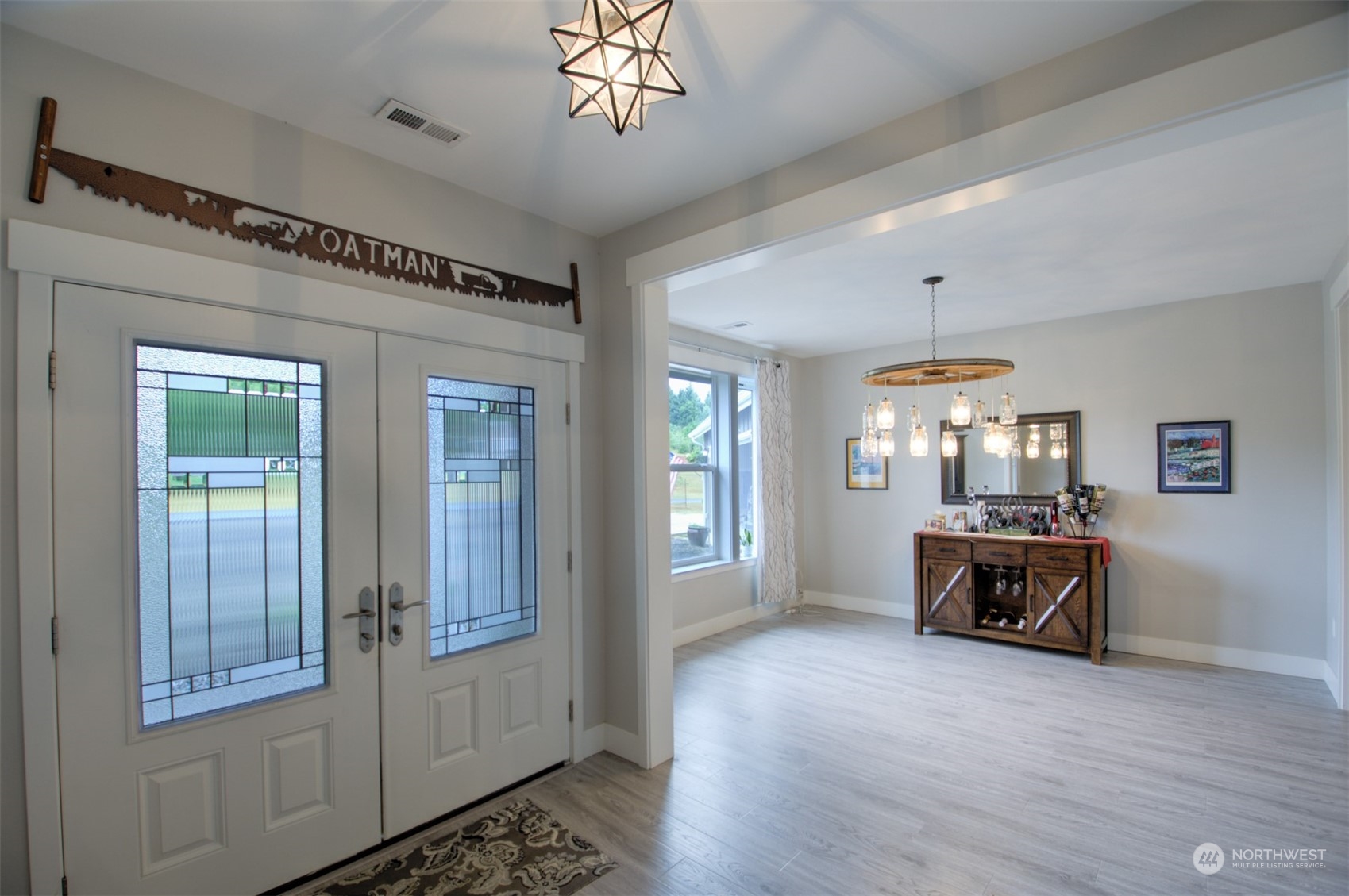 37 Richard Lane Elma, WA 98541 - Photo 4 of 26 a view of a livingroom with furniture chandelier and wooden floor