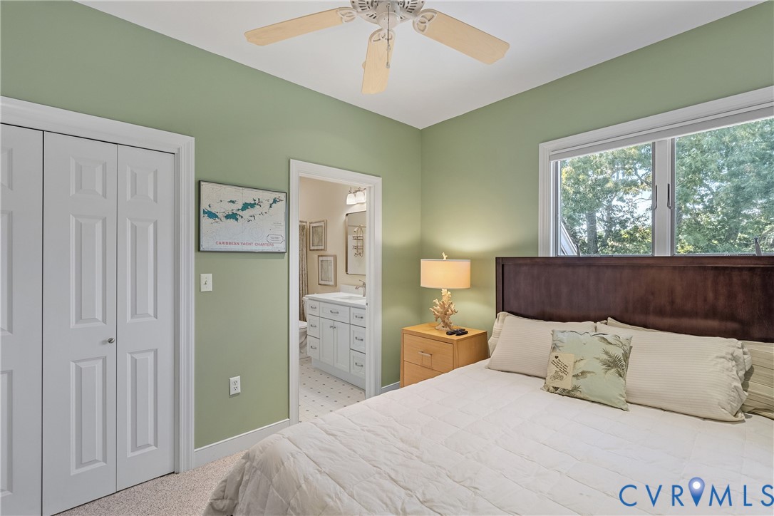 447 Tranquility Road Reedville, VA 22539 - Photo 46 of 82 Light green walls with white trim, a ceiling fan,