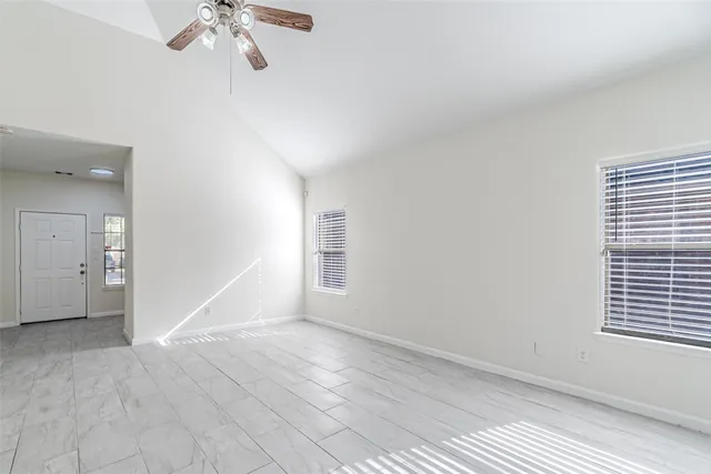 a view of an empty room with a window