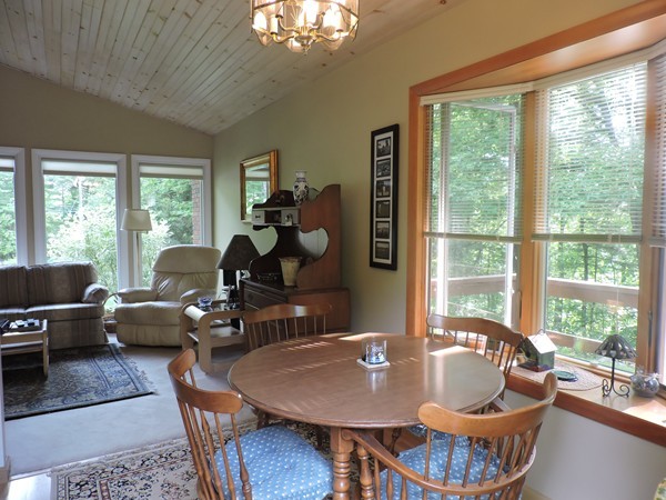 9 Hunter Hill Road Monson, MA 01057 - Photo 14 of 26 a dining room with furniture a chandelier and wooden floor