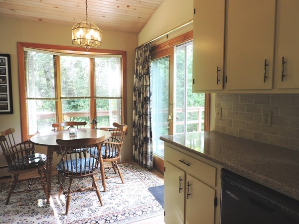 9 Hunter Hill Road Monson, MA 01057 - Photo 15 of 26 a view of a dining room with furniture a chandelier and wooden floor