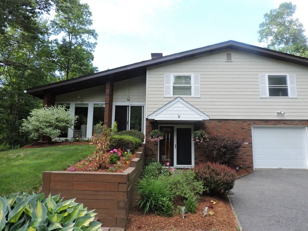 9 Hunter Hill Road Monson, MA 01057 - Photo 26 of 26 a front view of a house with a yard