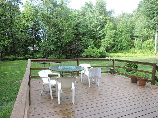 9 Hunter Hill Road Monson, MA 01057 - Photo 5 of 26 a view of a chairs and table on the wooden deck