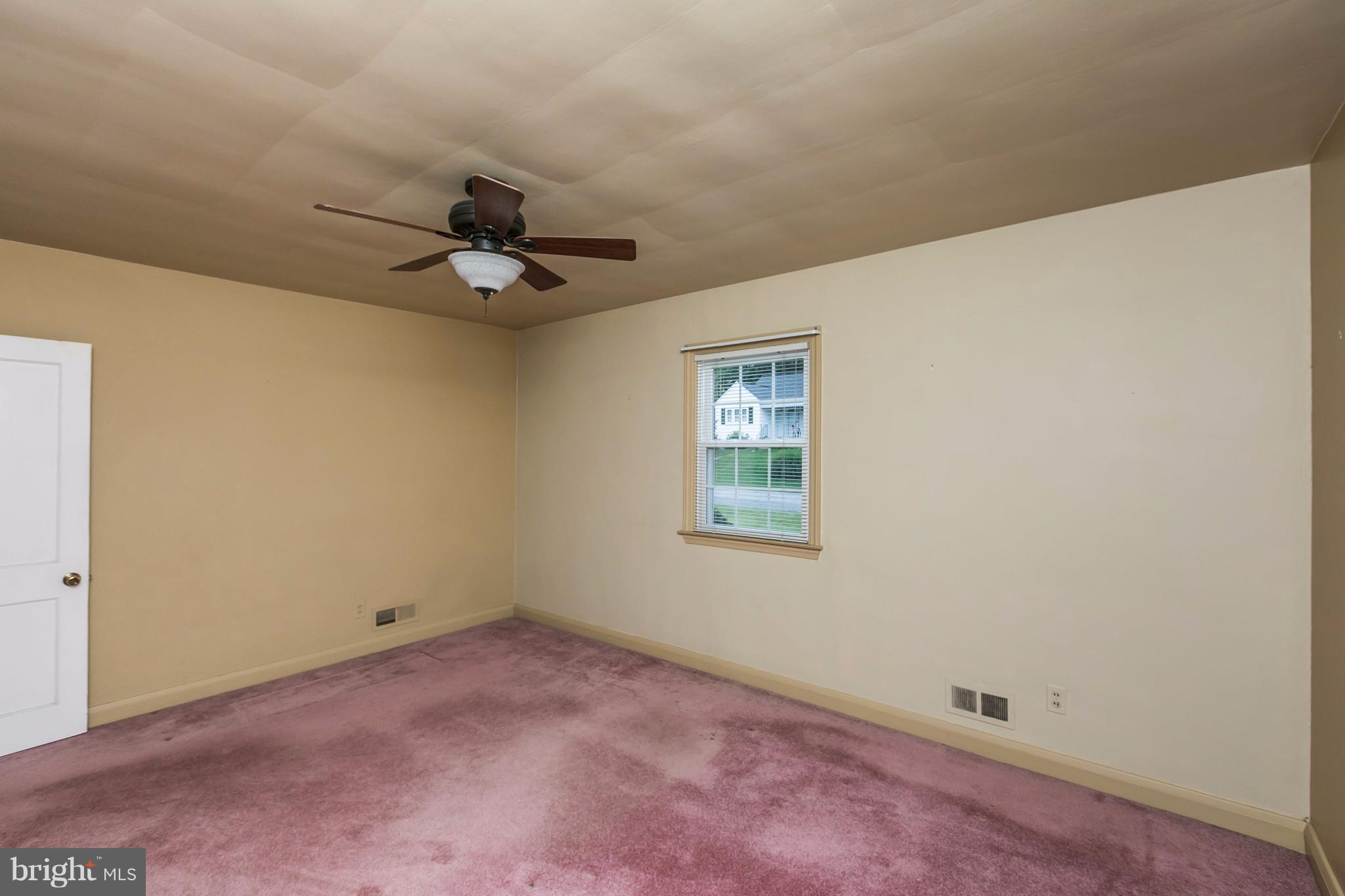 3629 Eitemiller Road Baltimore, MD 21244 - Photo 8 of 22 a view of a room with a ceiling fan and a window